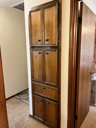 a bedroom with a bed furniture and decor