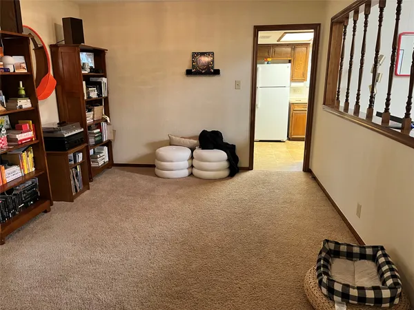 a room with furniture and a book shelf