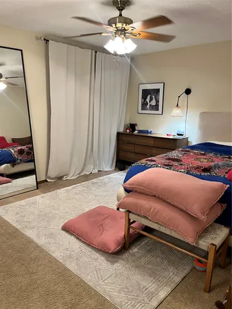 a bedroom with a bed and window