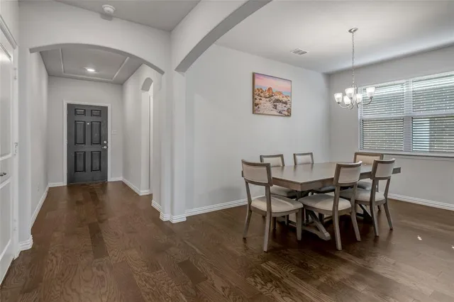 a view of a dining room with furniture and window