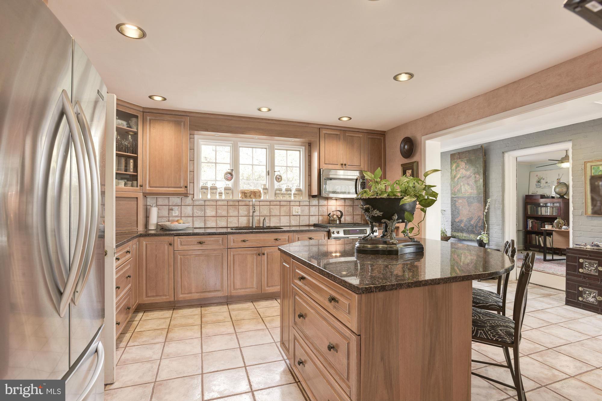 606 Coventry Road Towson, MD 21286 - Photo 6 of 30 granite, stainless, island, backsplash and more.
