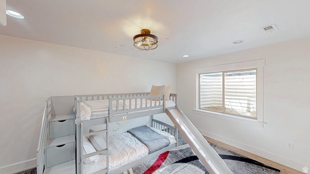 368 East 700 North Springville, UT 84663 - Photo 28 of 55 Bedroom with recessed lighting, wood finished floors, and a nursery area