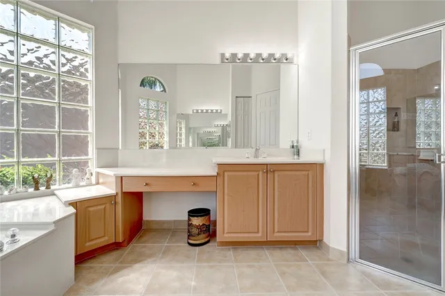 a bathroom with a sink double vanity and a mirror