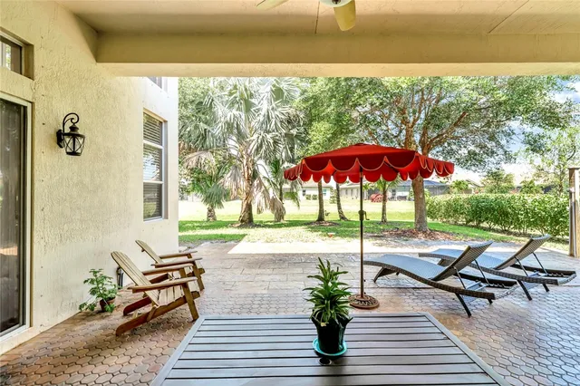a view of a patio with a table chairs and a patio