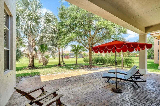 a sitting area with furniture and a yard