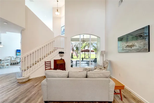 a living room with furniture and a large window