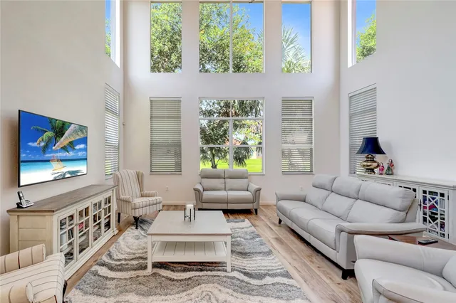 a living room with furniture and a large window