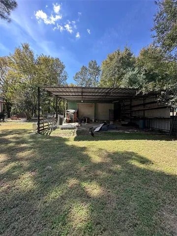 a swimming pool with outdoor seating and yard