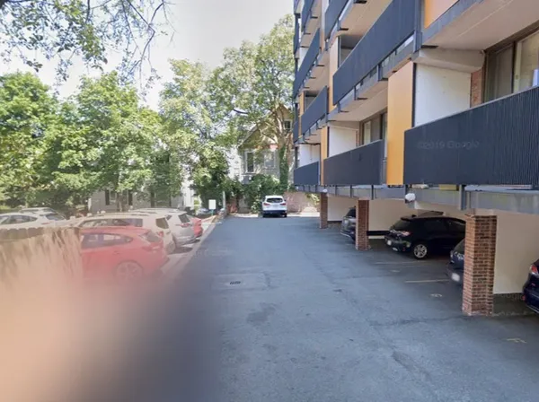 a view of a street with cars