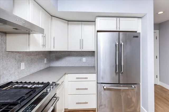 a view of a room with a large window