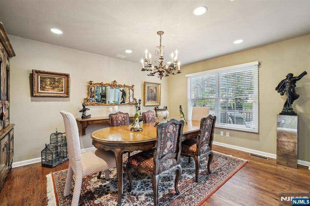 12 Hadley Lane Wayne, NJ 07470 - Photo 11 of 36 a view of a dining room with furniture window and wooden floor