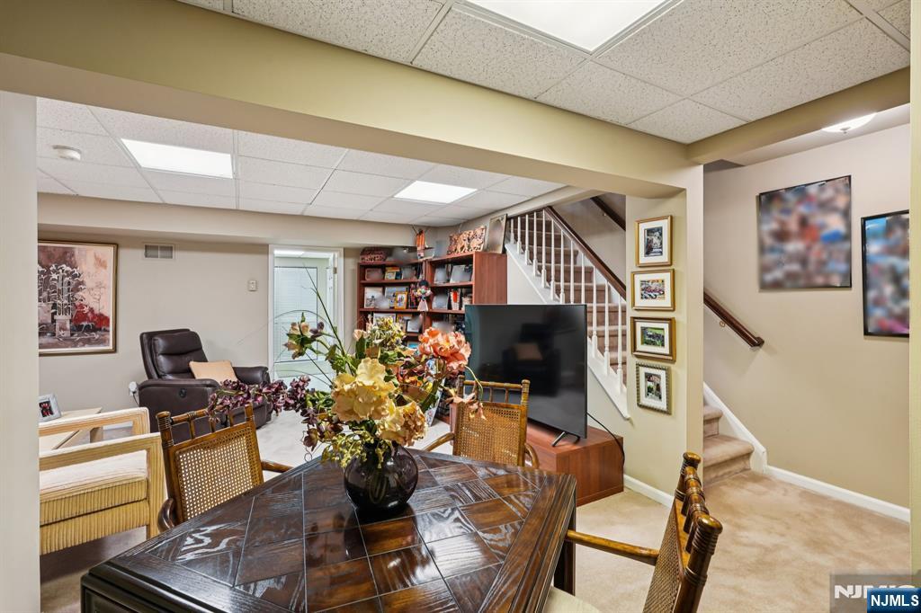 12 Hadley Lane Wayne, NJ 07470 - Photo 25 of 36 a work room with furniture a rug and a window