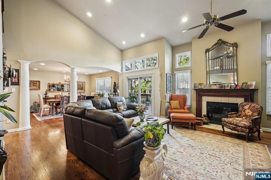 12 Hadley Lane Wayne, NJ 07470 - Photo 9 of 36 a living room with furniture and a fireplace