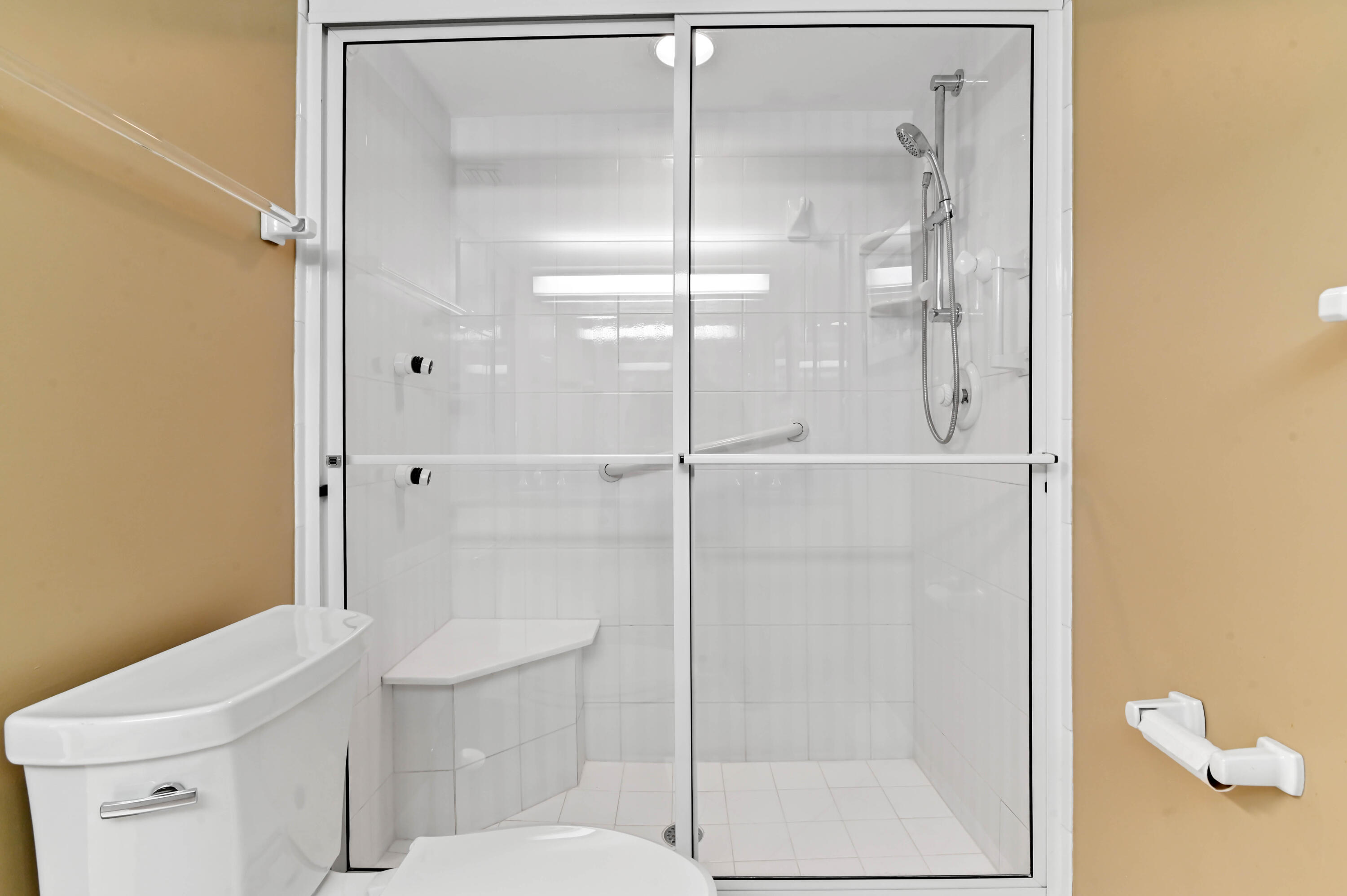 2800 South Ocean Boulevard, Unit 5J Boca Raton, FL 33432 - Photo 20 of 56 a bathroom with a shower a toilet and a sink
