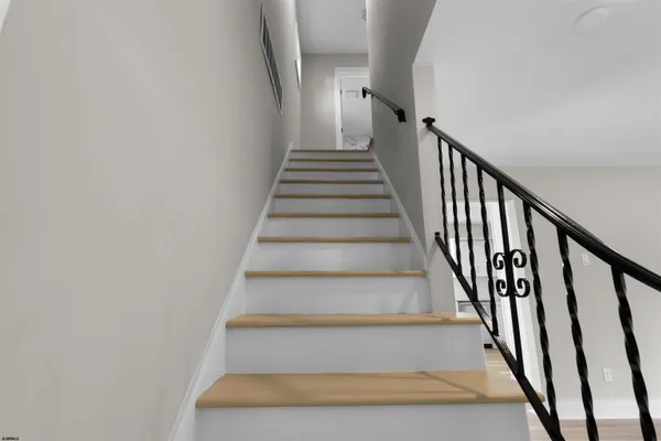 a bedroom with furniture and window