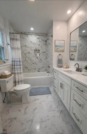 a bedroom with a large bed and a large window