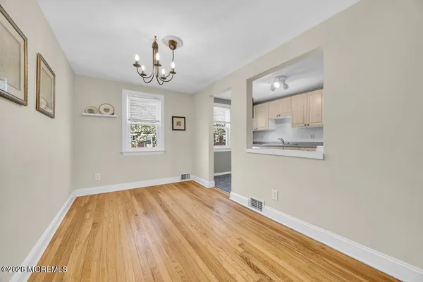 a kitchen that has a sink stove and cabinets