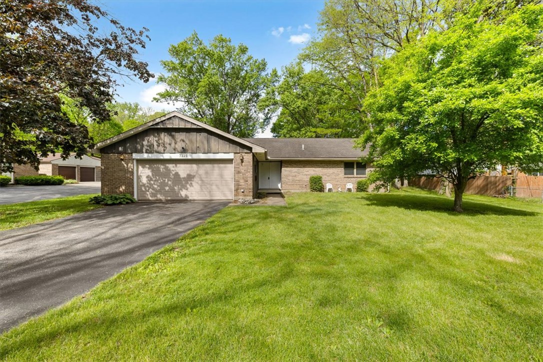 7225 Garber Road Clayton, OH 45415 - Photo 3 of 33 This classic brick ranch home features a verdant lawn and mature trees.