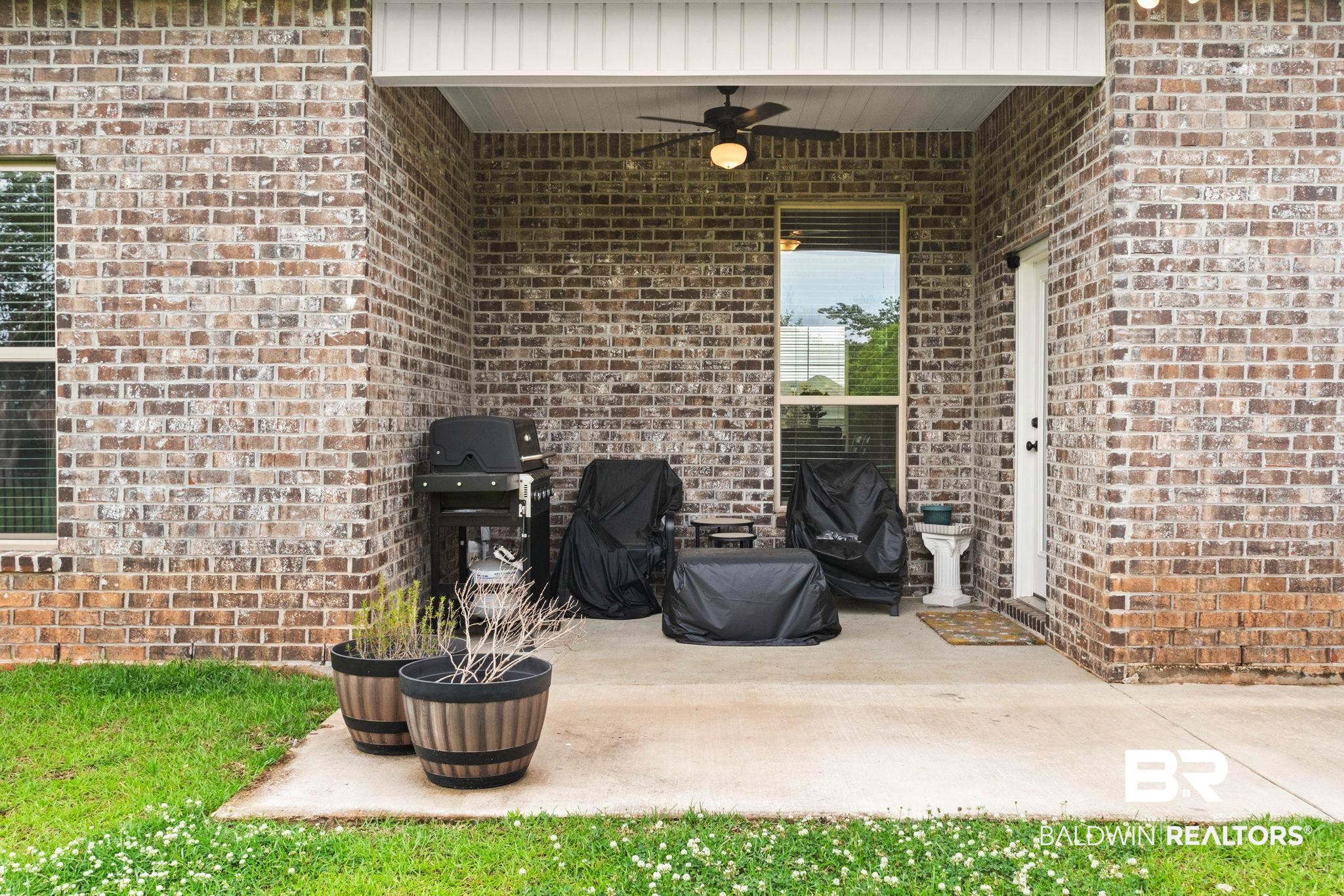 22244 Hibiscus Circle Foley, AL 36535 - Photo 11 of 51 Covered patio featuring a ceiling fan, recessed lighting, and brick construction