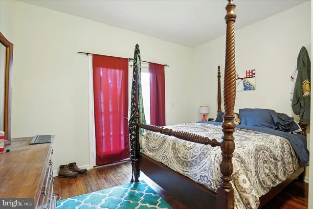 a bed room with a bed and a window