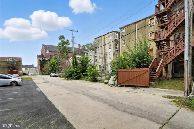 a view of a building with sitting area