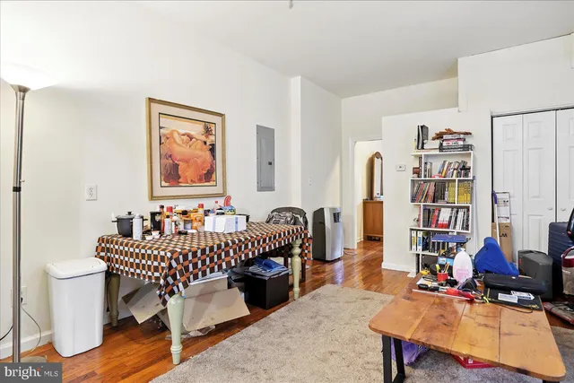 a bedroom with furniture and a book shelf
