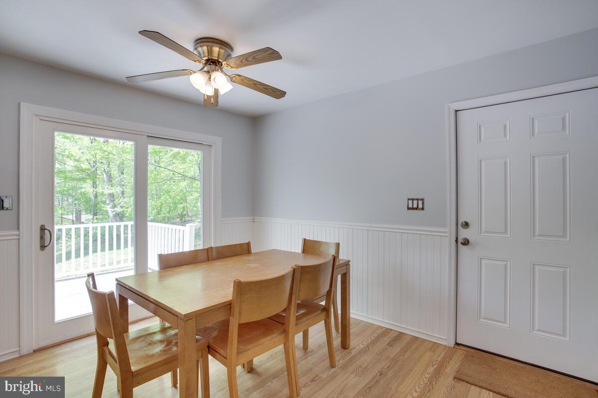 1420 Wilson Road Huntingtown, MD 20639 - Photo 11 of 43 a view of a dining room with furniture window and wooden floor