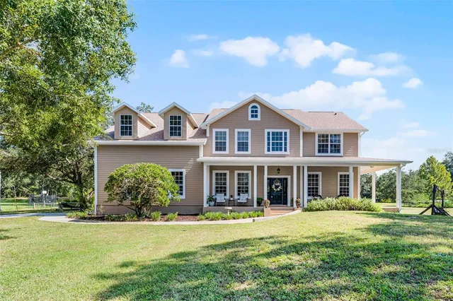 front view of a house with a yard