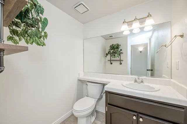 a bathroom with a sink and cabinets
