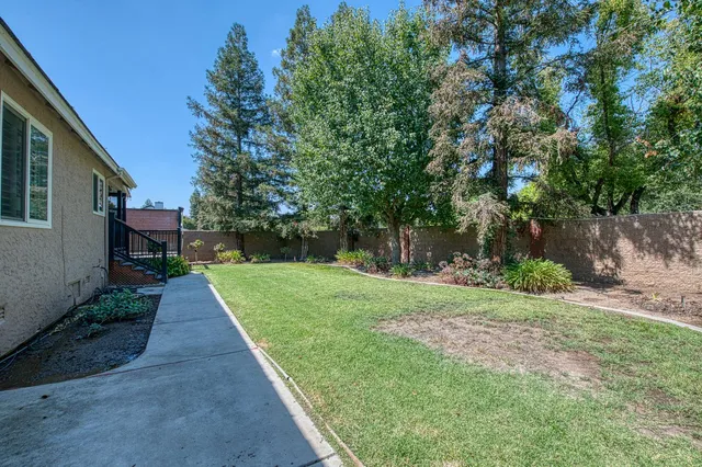a front view of house with yard and outdoor seating