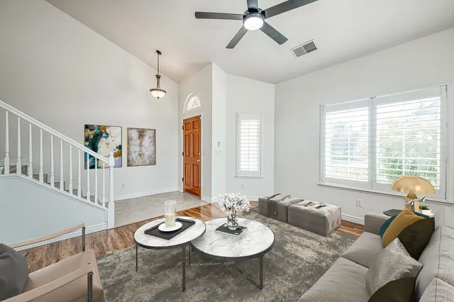 a living room with furniture and a table