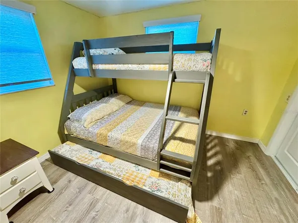 a bedroom with bed and window