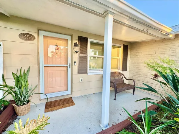 a lobby with furniture and a potted plant