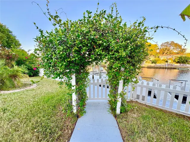 a view of house with backyard