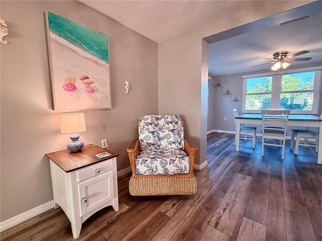 a room with furniture and wooden floor