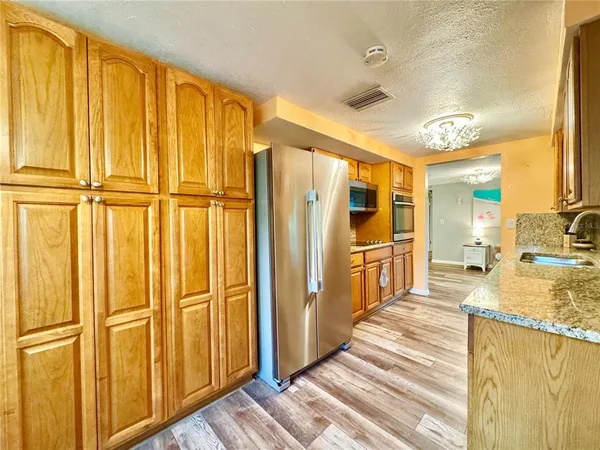 a view of a bathroom with sink and door