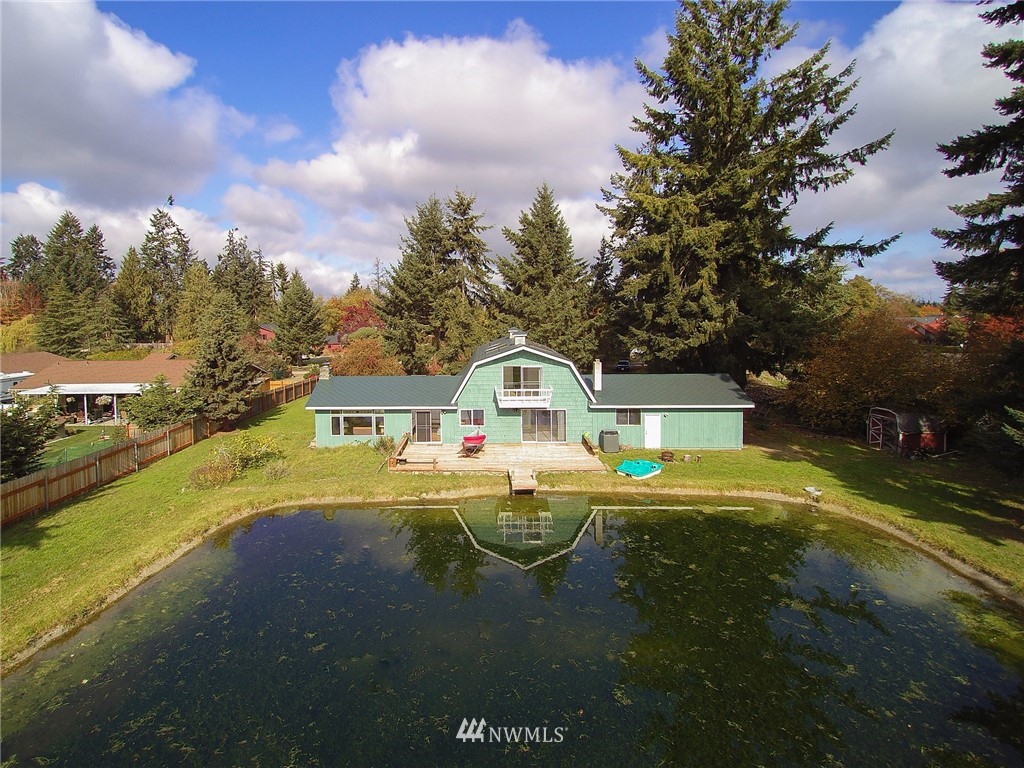 103 Rondale Drive Sequim, WA 98382 - Photo 2 of 35 a front view of a house with a garden