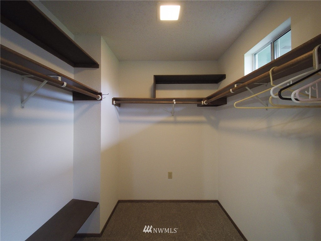 103 Rondale Drive Sequim, WA 98382 - Photo 20 of 35 a view of a room with racks on the wall