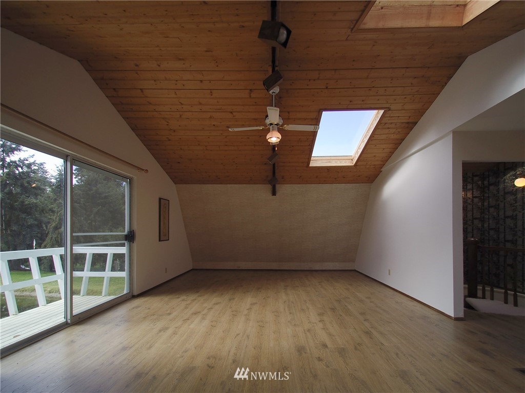 103 Rondale Drive Sequim, WA 98382 - Photo 24 of 35 a view of empty room with wooden floor