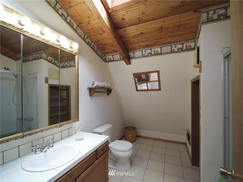 103 Rondale Drive Sequim, WA 98382 - Photo 27 of 35 a bathroom with a sink a toilet and shower