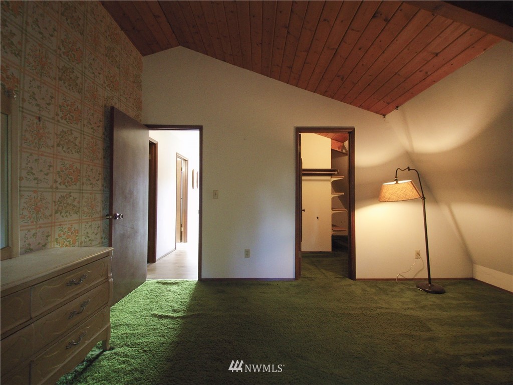 103 Rondale Drive Sequim, WA 98382 - Photo 30 of 35 a view of an empty room with wooden floor and a window