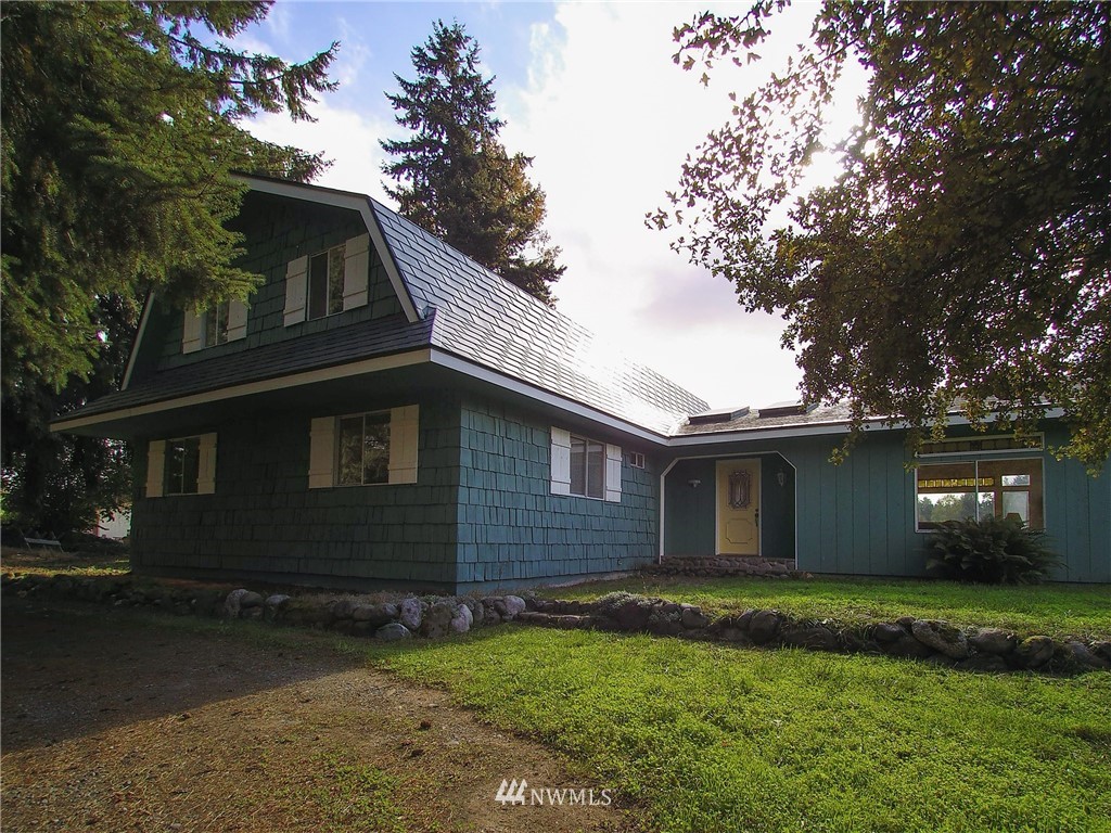 103 Rondale Drive Sequim, WA 98382 - Photo 4 of 35 a front view of a house with a garden