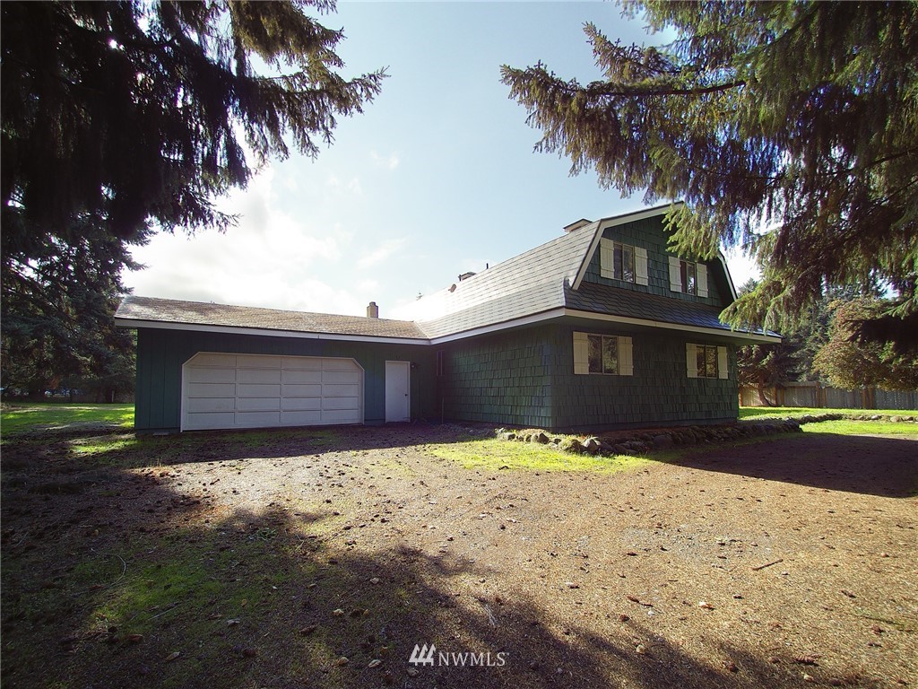 103 Rondale Drive Sequim, WA 98382 - Photo 32 of 35 a front view of a house with a yard covered with snow