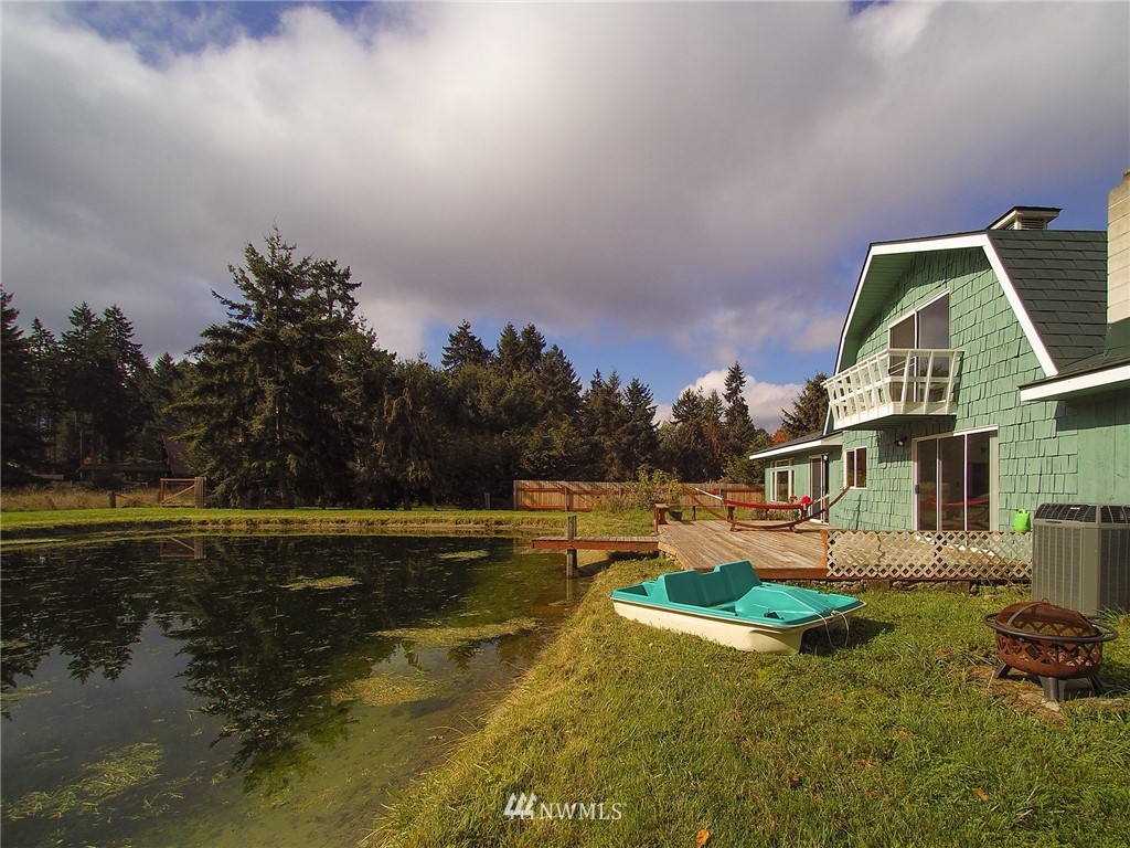 103 Rondale Drive Sequim, WA 98382 - Photo 34 of 35 a view of a house with pool and a yard
