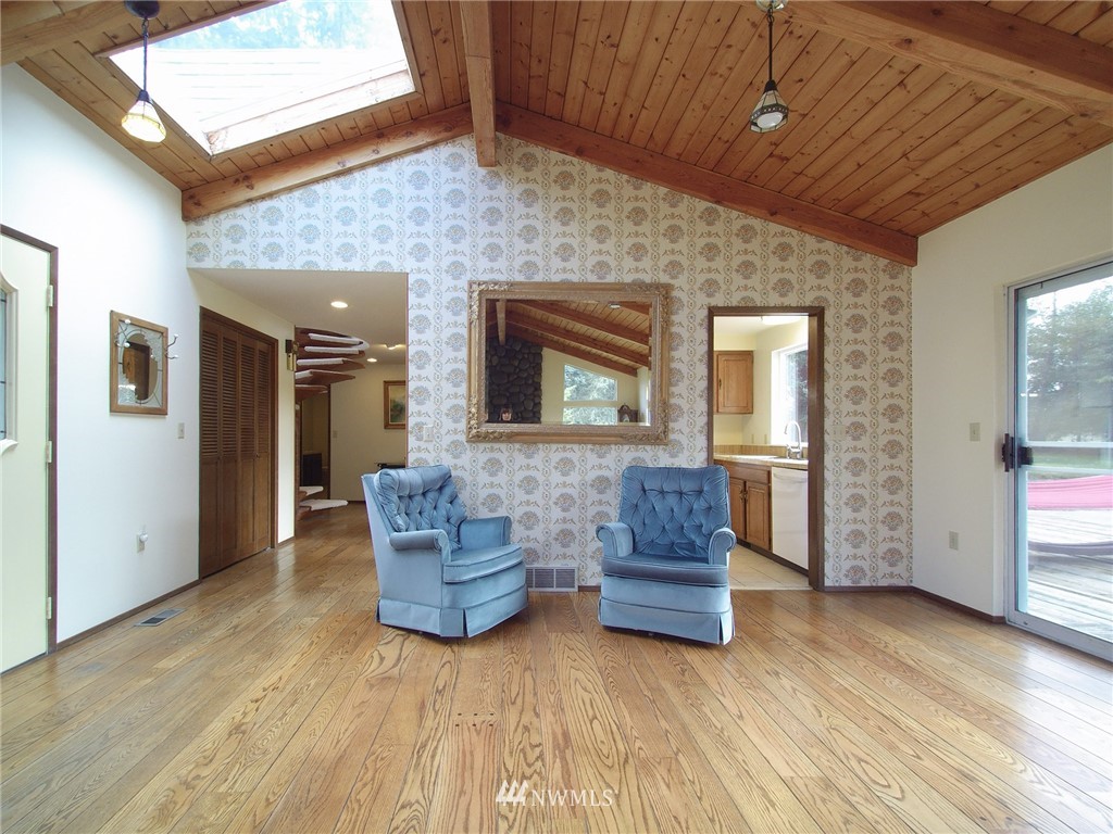 103 Rondale Drive Sequim, WA 98382 - Photo 8 of 35 a living room with couches and kitchen view with wooden floor