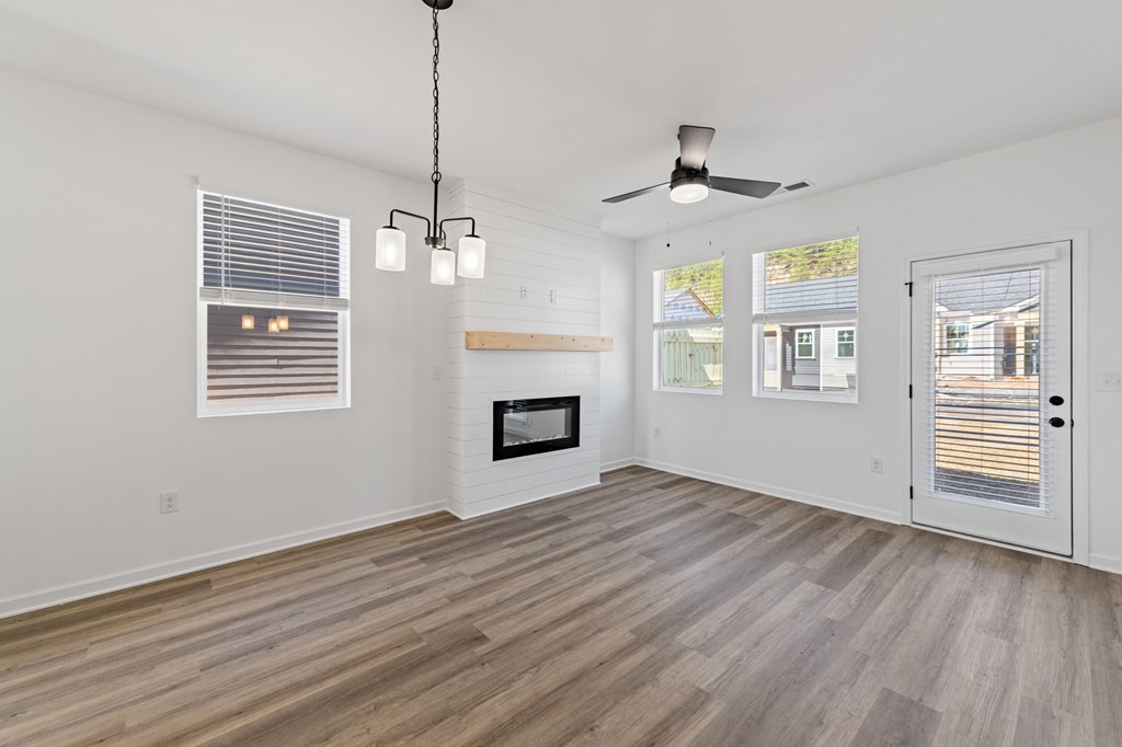 19 Grove Loop Blue Ridge, GA 30513 - Photo 15 of 20 a view of an empty room with a window and wooden floor