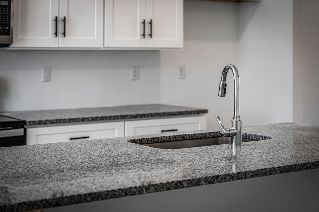19 Grove Loop Blue Ridge, GA 30513 - Photo 20 of 20 a kitchen with granite countertop a sink and a stove