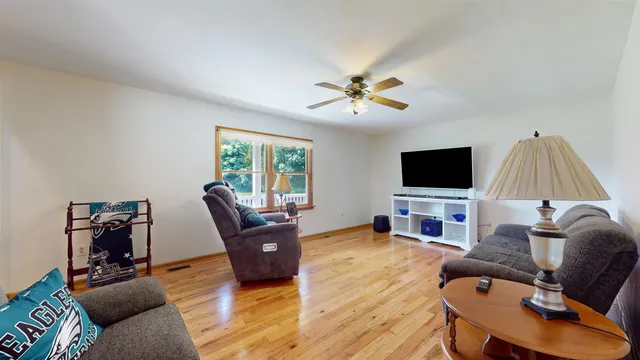 a bedroom with bed and a chandelier