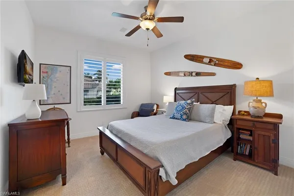 a spacious bedroom with a bed and a table