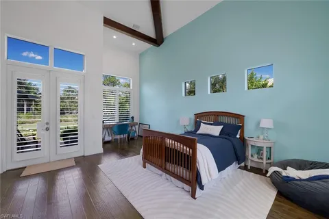 a bed room with a bed and a chair